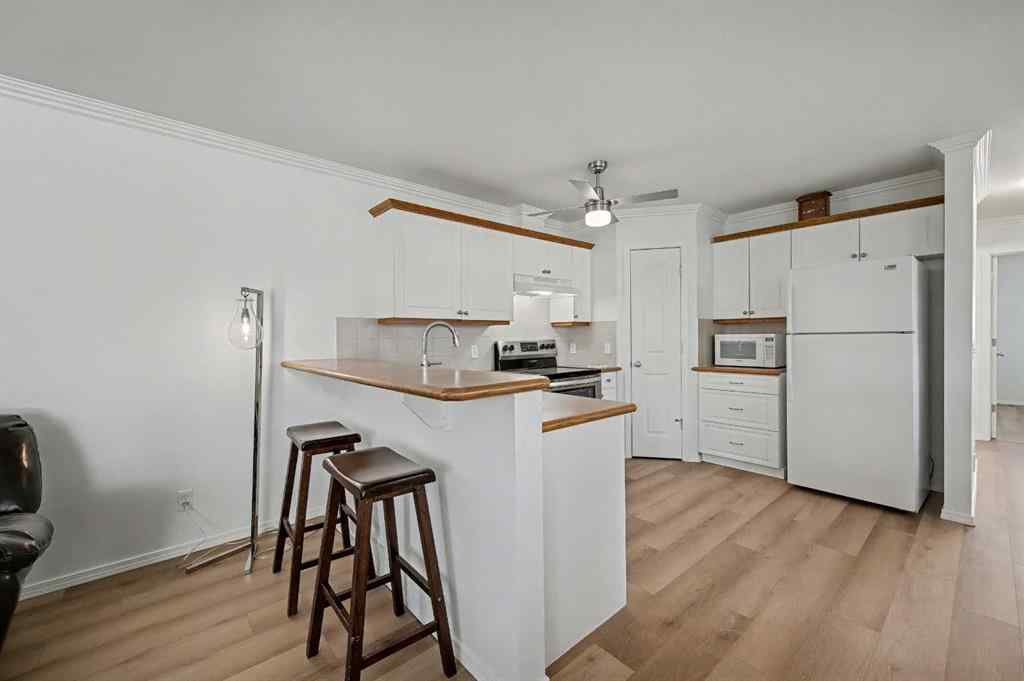 MLS&reg; # A2271045 - 1409 Strathcona Way  in Strathaven Strathmore, Residential Open Houses