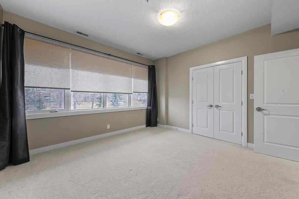MLS® # A2271234 - Unit #402 476 14 Street NW in Hillhurst Calgary, Residential Open Houses