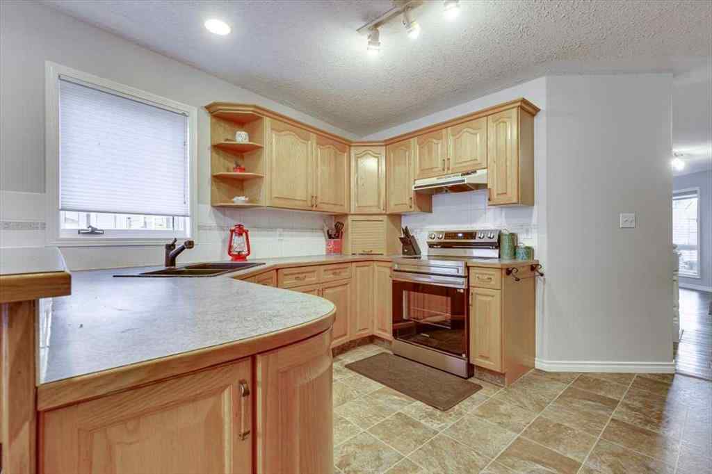 MLS&reg; # A2271490 - 14 Lawrence Crescent  in Lancaster Meadows Red Deer, Residential Open Houses