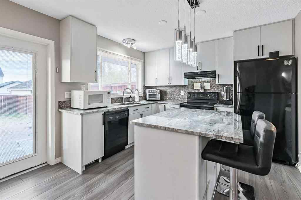 MLS&reg; # A2271630 - 307 Elgin Place SE in McKenzie Towne Calgary, Residential Open Houses