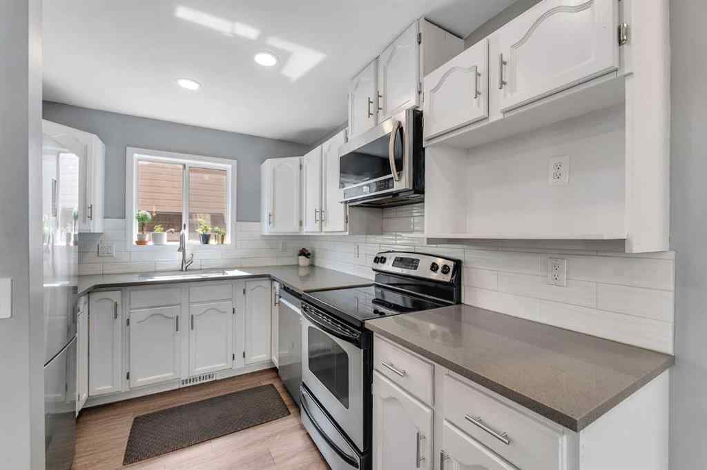 MLS&reg; # A2271699 - 63 Erin Green Way SE in Erin Woods Calgary, Residential Open Houses