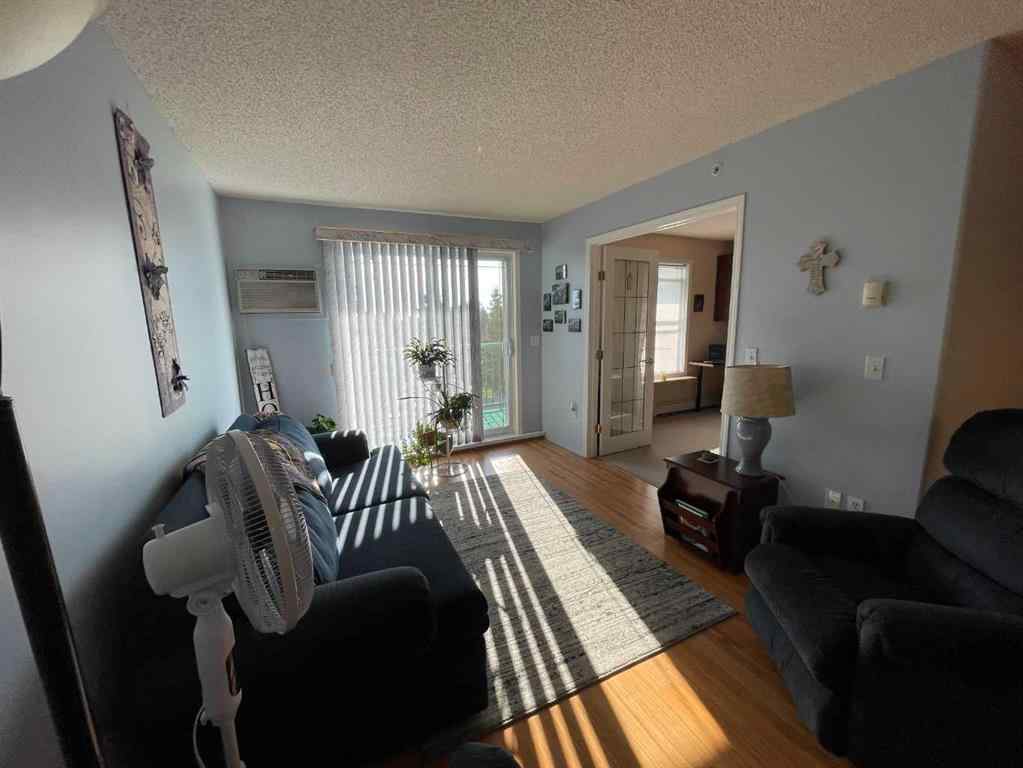 MLS&reg; # A2271728 - Unit #405 1881 17 Street  in NONE Didsbury, Residential Open Houses